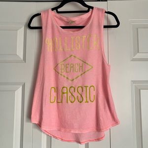 Hollister, pink, and gold logo tank top